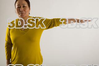 Arm flexing reference of yellow sweater blue jeans Gwendolyn 0003